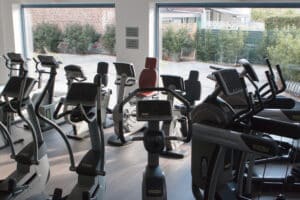 Fitness center with cycling machines and cross trainers