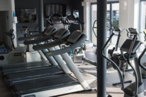 fitness center with treadmills and walking machines
